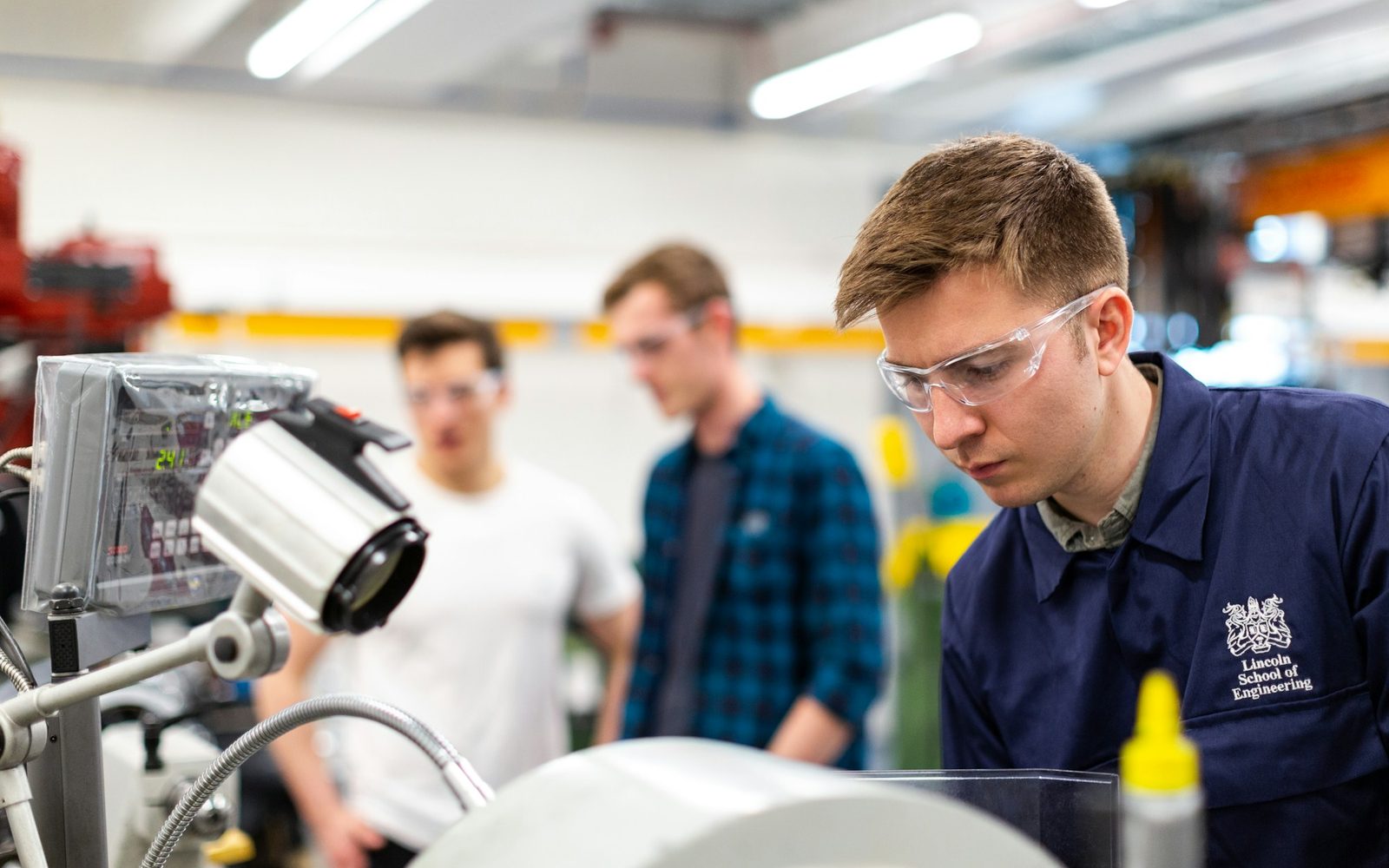 Engineers at work on a technical bench